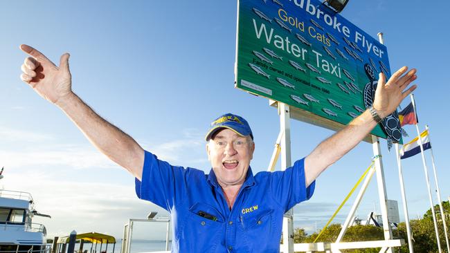 Stradbroke Flyer shuttle bus driver Willie Clarke celebrates the reopening of the island, at the Cleveland terminal today. Picture: Renae Droop