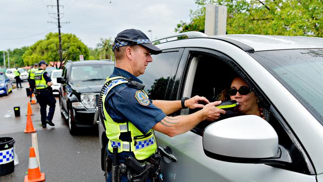 NT Police Acting Sergeant Clint Richardson tests a driver during a roadside breath testing station at Mindil Beach for Operation Sepio.