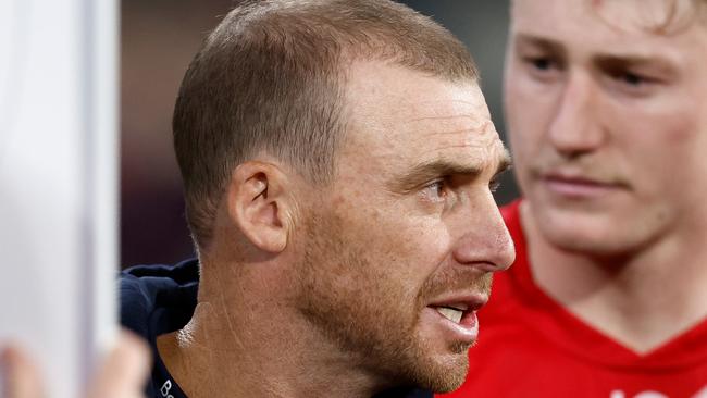 MELBOURNE, AUSTRALIA - APRIL 11: Simon Goodwin, Senior Coach of the Demons addresses his players during the 2024 AFL Round 05 match between the Melbourne Demons and the Brisbane Lions at the Melbourne Cricket Ground on April 11, 2024 in Melbourne, Australia. (Photo by Michael Willson/AFL Photos via Getty Images)