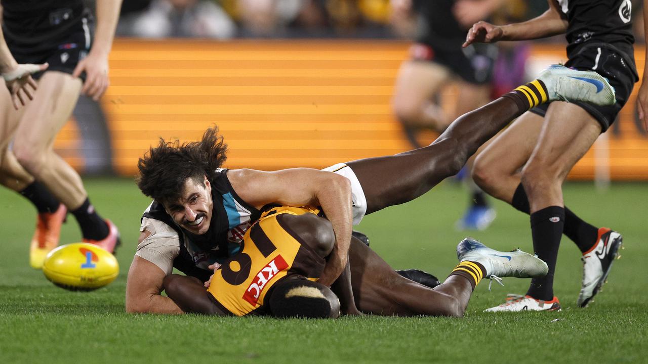 NCA. ADELAIDE, AUSTRALIA. September 13, 2024. AFL Semi Finals. Hawthorn vs Port Adelaide at the Adelaide Oval. Hawthorns Mabior Chol is tackled by Ports Lachie Jones in the second quarter. Picture: Michael Klein