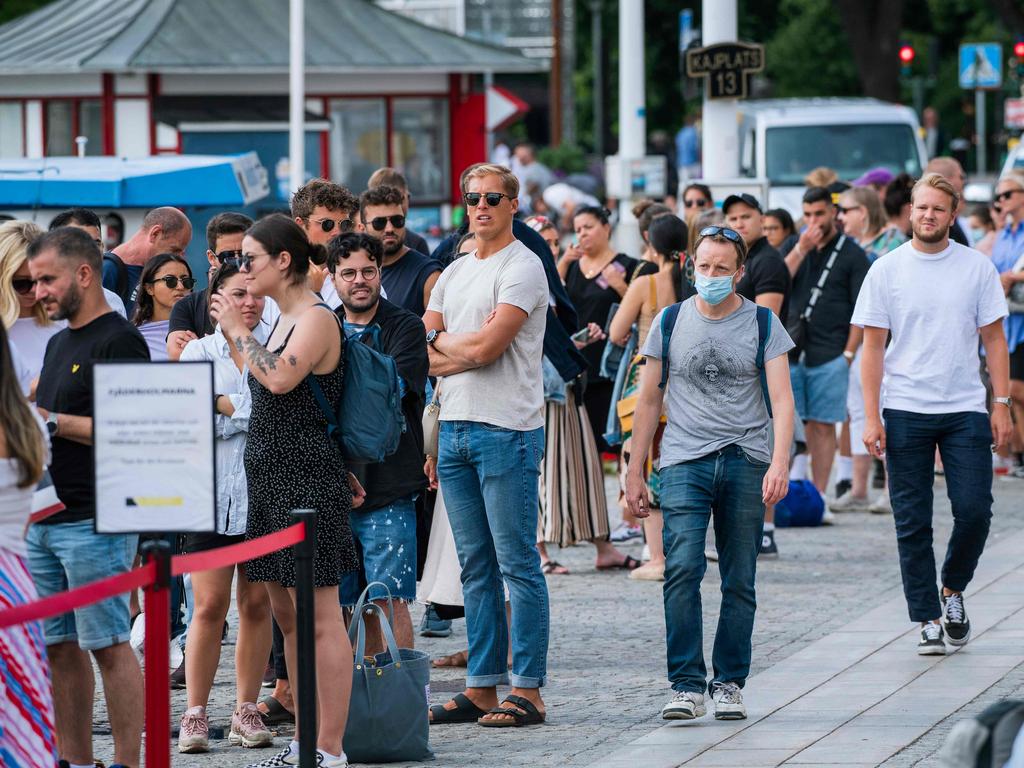 A man wearing a protective face mask is in the minority in Stranvagen, Stockholm. Picture: Jonathan Nackstrand/AFP