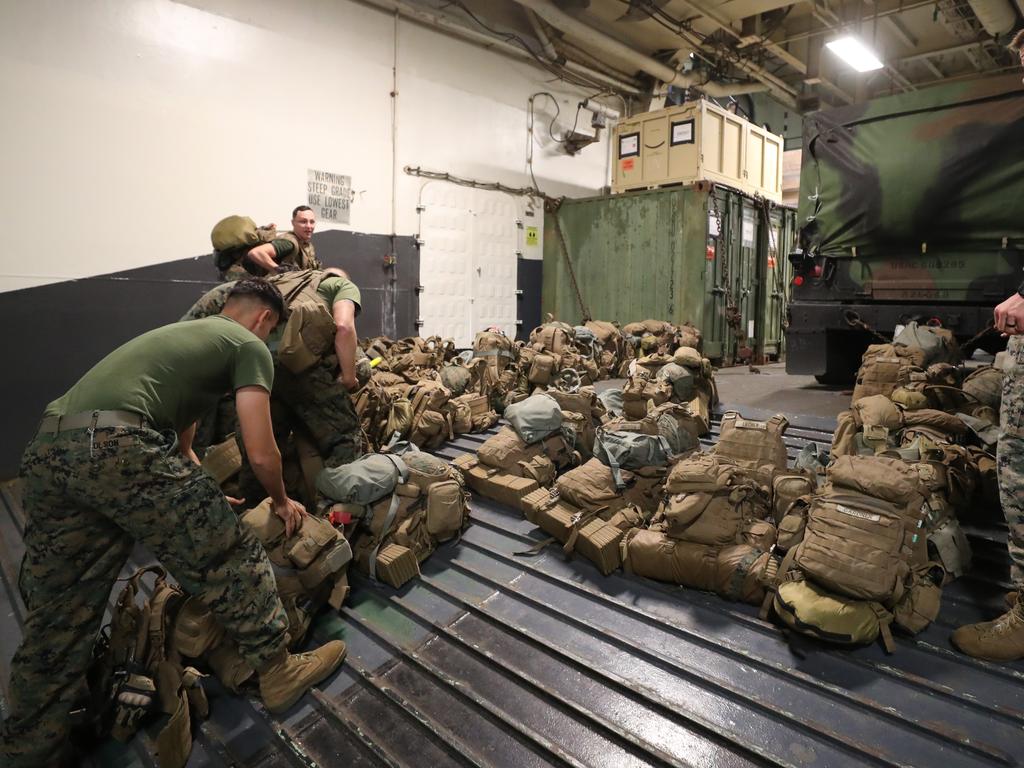 Marines on USS Wasp preparing for the assault. Picture: Peter Wallis