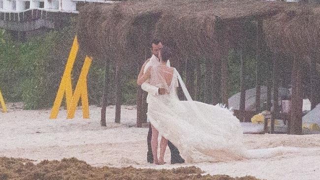 The pair married at sunset and posed up for pictures on the beach after the wedding. Picture; BACKGRID