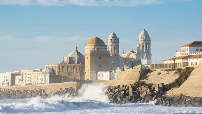 View of the Cadiz cathedral across the Atlantic Ocean, Spain.