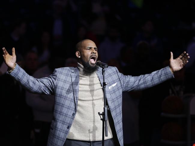 Artist R. Kelly performs the national anthem before an NBA basketball game between the Brooklyn Nets and the Atlanta Hawks in New York. Picture: Frank Franklin II