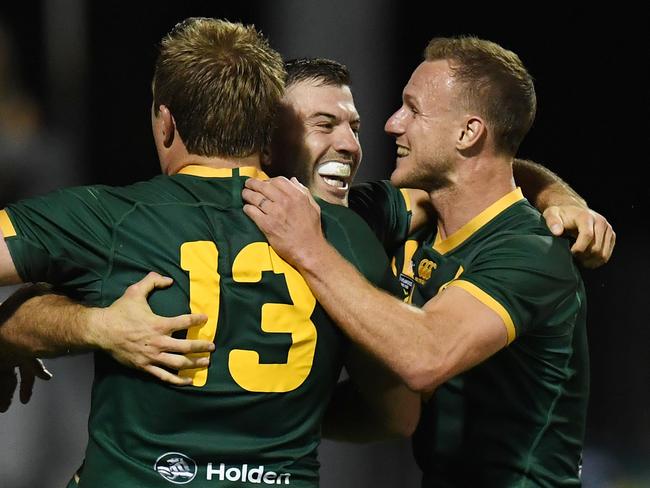 James Tedesco of the Kangaroos celebrates his try with team mates Jake Trbojevic and Daly Cherry-Evans after scoring a try during the Oceania Cup Test Match between Australia and New Zealand at WIN Stadium in Wollongong, Friday, October 25, 2019. (AAP Image/Dean Lewins) NO ARCHIVING, EDITORIAL USE ONLY