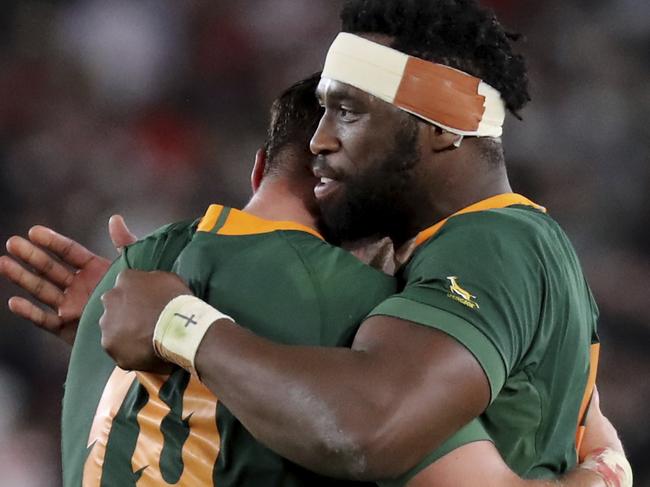 South Africa's captain Siya Kolisi, right, celebrates with teammates after winning the Rugby World Cup final at International Yokohama Stadium in Yokohama, Japan, Saturday, Nov. 2, 2019. (AP Photo/Eugene Hoshiko)