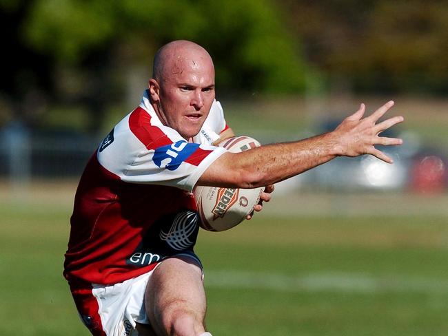 27/08/2006:  Mick Roberts evades a Scott Smith tackle - North Queensland Young Guns v Redcliffe Dolphins (Townsville Sports Reserve).