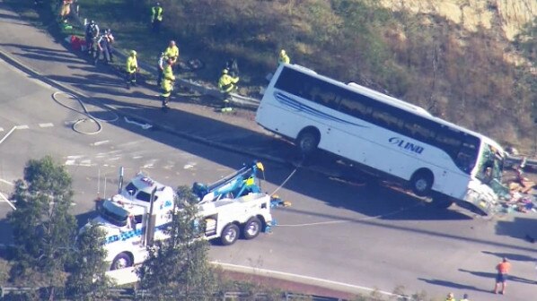 A horror bus crash in the Hunter Valley over night has claimed 10 lives with many more in hospital. The bus is righted with a tow truck. Picture: 9 News