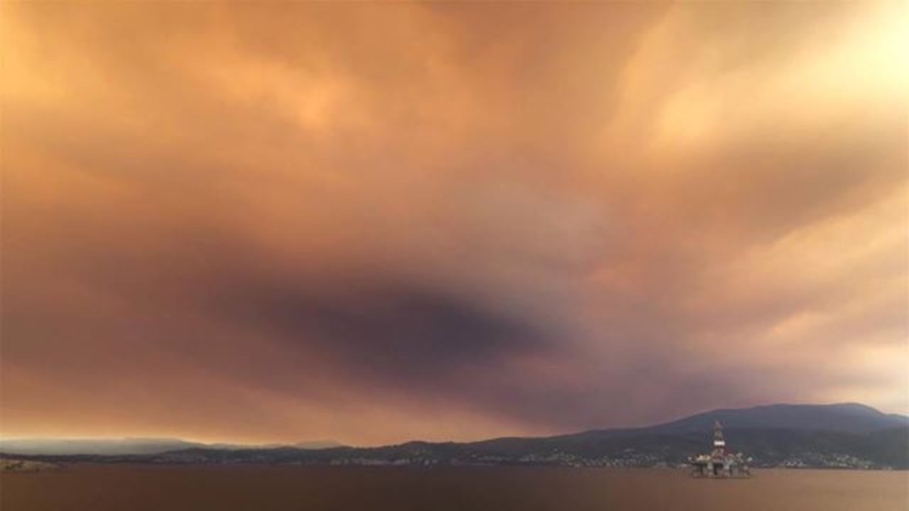 Haze seen over the Derwent from the uncontrolled bushfire raging the the Southwest of the state. Picture: BEN TREMAYNE