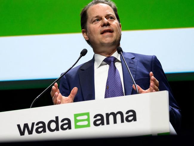 (FILES) World Anti-Doping Agency (WADA) Director General Olivier Niggli delivers a speech at the opening of the two-day annual symposium in Lausanne on March 14, 2023. China's swimmers head to the Paris Olympics under fierce scrutiny with 11 of the squad among a group who tested positive for a banned substance in the lead-up to the Tokyo Games. (Photo by Fabrice COFFRINI / AFP)