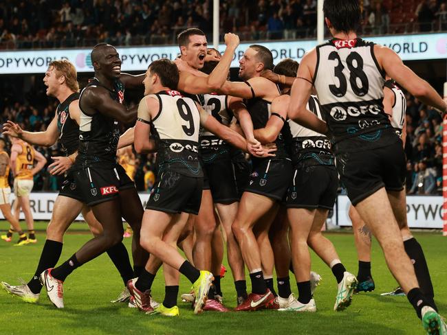 The Power celebrate the winning goal in their clash with Hawthorn on Sunday. Picture: James Elsby/AFL Photos via Getty Images.