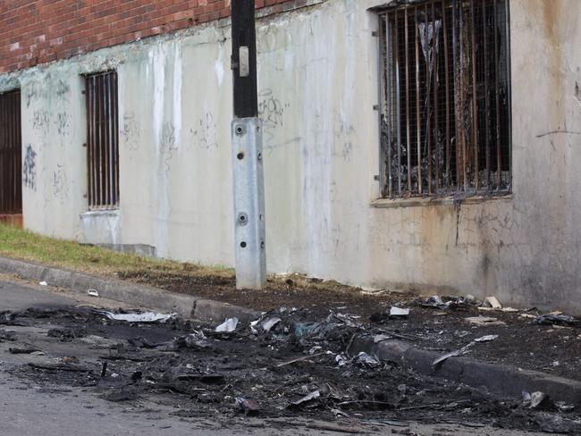 The charred remains of the burnt out car. Picture: Timothy Clapin