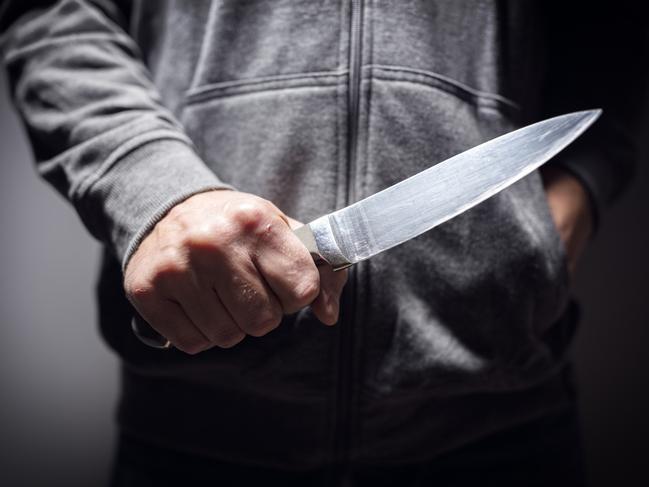 Generic crime Istock  -  Criminal with knife weapon threatening to stab