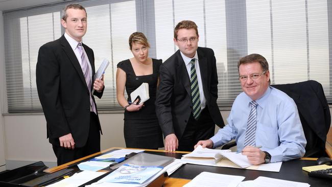 Former adviser now lobbyist Brad Green (left) pictured in his days as a staffer for then-treasurer Kevin Foley (seated), with fellow staffer Fiona Webber and current opposition treasury spokesman Stephen Mullighan.