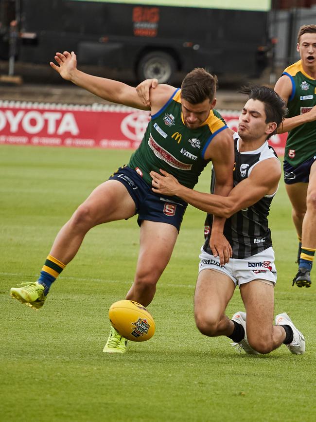 Eagle's Sam Rowland gets tackled in the 2018 SANFL Fast Footy tournament at Norwood Oval. Picture: AAP/Matt Loxton