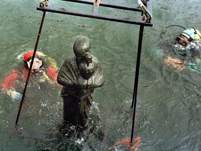 A 1.5m black granite statue of a priest dating to the 1st century is hoisted out of the sea off the Egyptian coast as researchers discover an ancient underwater city containing Cleopatra’s palace and relics.