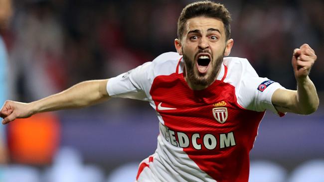 (FILES) A file photo taken on March 15, 2017 at the Stade Louis II in Monaco shows Monaco's Portuguese midfielder Bernardo Silva celebrating after his team scored a goal during the UEFA Champions League football match Monaco and Manchester City. Portuguese playmaker Bernardo Silva is to join Manchester City from French champions Monaco on July 1, 2017 the English Premier League club announced on May 26, 2017. / AFP PHOTO / Valery HACHE