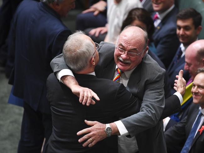 Liberal MP Warren Entsch hugs Australian Prime Minister Malcolm Turnbull after the passing of the Marriage Amendment Bill. Picture: AAP