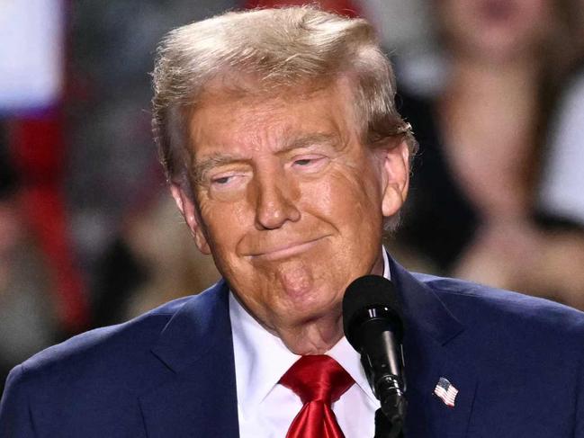 TOPSHOT - Former US President and Republican presidential candidate Donald Trump speaks during a campaign rally at Huntington Place in Detroit, Michigan, October 18, 2024. (Photo by Jim WATSON / AFP)