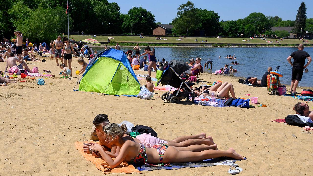 Sun bathers at Ruislip Lido in west London. Picture: Justin Tallis/AFP