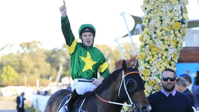 Tommy Berry and Ole Kirk return to scale after winning the Golden Rose.