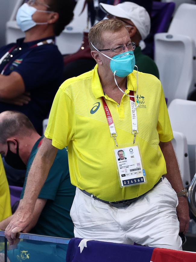 John Coates takes in the swimming at the Tokyo Olympics.