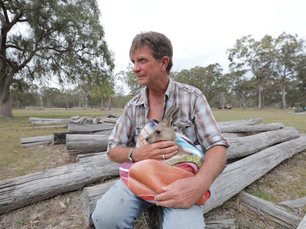 Mark Reiser, with joey Emily, had to evacuate his Deepwater property. Picture Mark Cranitch