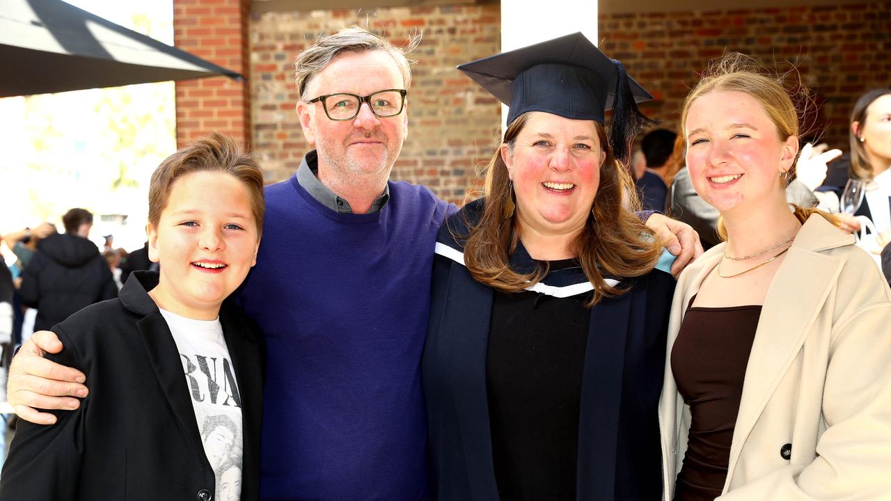 Deakin University graduate Nerae Preece with husband Damien son Theo, 11, and Charlotte, 15.Picture: Alison Wynd