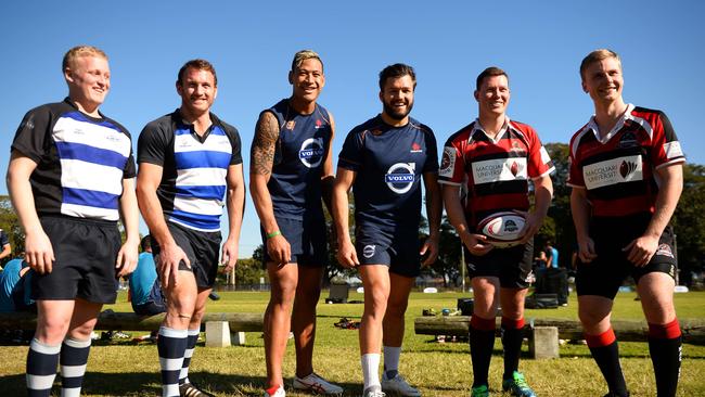 (L to R) Rugby union players Jason Fowler and Brennan Bastyovanszky of the Sydney Convicts, Israel Folau and Adam Ashley-Cooper of the NSW Waratahs and Donovan Baker and Tim Mugglestone of Macquarie University pose for a photo after a training session in Sydney on July 3, 2014. Australia's Sydney Convicts team will make history this weekend when they become the first gay rugby team in the world to play on the same bill as a professional match, team officials said on July 3. The Sydney Convicts will take on Macquarie University in the curtain-raiser to the Super Rugby game between the New South Wales Waratahs and New Zealand's Otago Highlanders in Sydney on July 6. AFP PHOTO / Peter PARKS IMAGE STRICTLY FOR EDITORIAL USE - STRICTLY NO COMMERCIAL USE