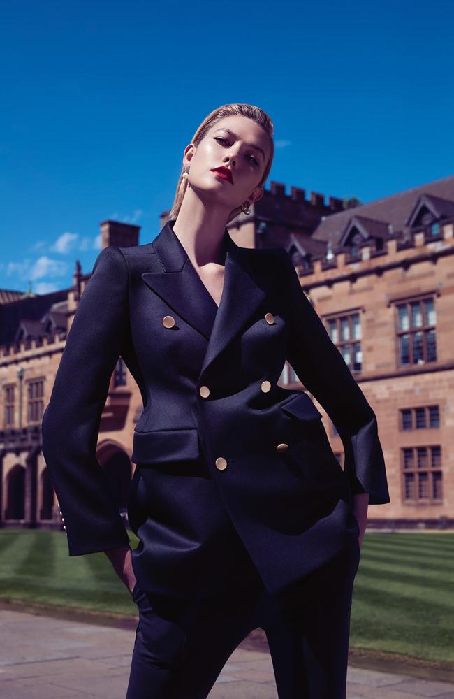 Karlie models Balenciaga blazer, Bassike pants and Chloé earrings.