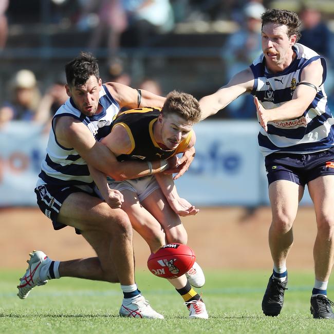 Yarrawonga’s Leigh Masters tackles an Albury opponent.