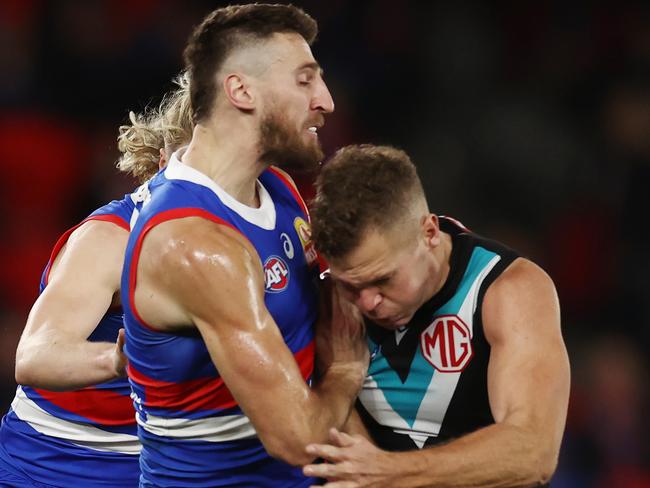 MELBOURNE - June 9 :   Bulldog Marcus Bontempelli crashes into Dan Houston of the Power 2nd quarter during the round 13  AFL match between Western Bulldogs and Port Adelaide at Marvel Stadium, on June 9, 2023, in Melbourne, Australia. Photo by Michael Klein.