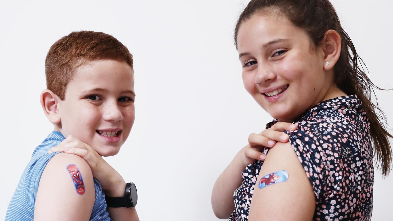 Archer Twomey, 8, and Scarlett Twomey, 10 received their first jab of the Pfizer vaccine on Sunday morning at their local pharmacy. Picture: Brendan Radke