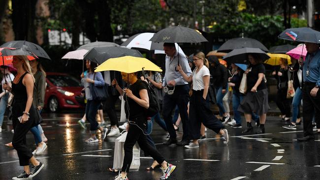 Umbrellas return to the streets of Sydney's CBD on Friday.