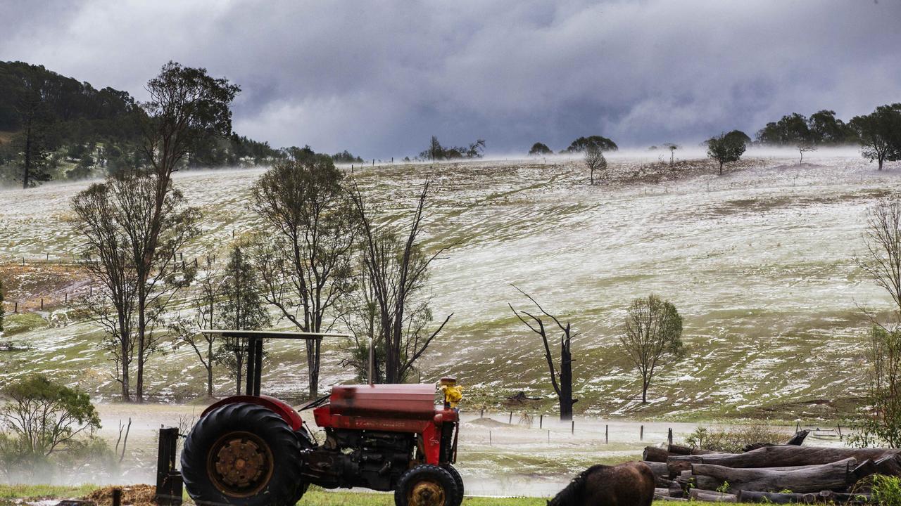 Properties at Long Flat south of Gympie resemble snowfields after a super cell dumped hail, tore down trees and caused devastation across the Burnett and South East. Photo Lachie Millard