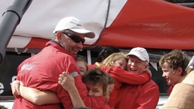 Young sailor Harry Smith greeting his father Ian in Hobart and a line honours win. Pic: Supplied