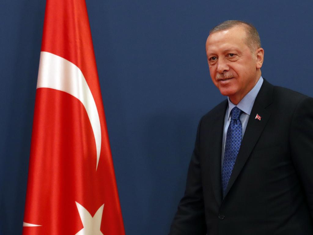 Turkey's President Recep Tayyip Erdogan arrives at a joint news conference after their trilateral meeting with Serbian President Aleksandar Vucic and members of Bosnia's tripartite presidency, Muslim member Sefik Dzaferovic, Croat member Zeljko Komsic and Bosnian Serb member Milorad Dodik, in Belgrade, Serbia, Tuesday, Oct. 8, 2019. (AP Photo/Darko Vojinovic)