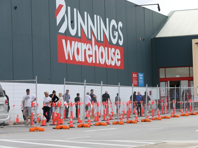 Shoppers in queue at Bunnings Warehouse, North Geelong on the first day of stricter  stage three  measures. People are not to gather in groups larger than 2.  Picture: Peter Ristevski