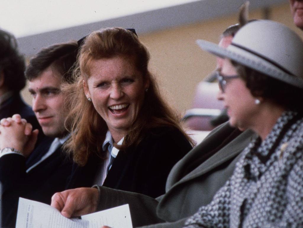 Sarah Ferguson, Duchess of York and husband Andrew, Duke of York with his mother Queen Elizabeth II in 1986. Picture: Supplied