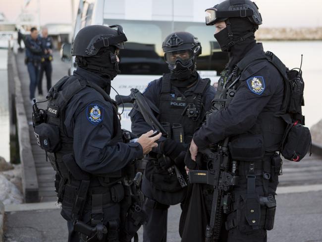 Tactical police officers after they swarmed the marina.