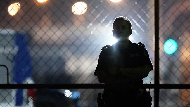 A police officer at the back of the Buff Club where one of victims’ bodies lay in the car park. Picture: Keri Megelus