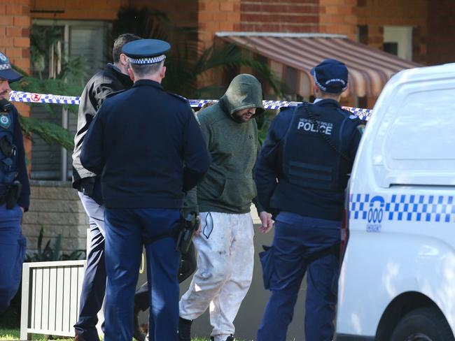 SYDNEY, AUSTRALIA : Newswire Photos- JULY 15 2024: Tactical Police and Detectives are at the scene of a unit complex in Dee Why in Sydney where a crime scene has been established after a body was found. A man in a green hoodie was escorted from the premises by NSW Police to assist with their investigation. About 7:11am today (Monday 15 July 2024), emergency services were called to Ilikai Place, Dee Why, following reports of a body in a carpark. Picture: Newswire / Gaye Gerard