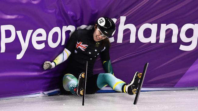 Deanna Lockett crashes in the women's 1500m short track speed skating semi-final. Picture: AFP