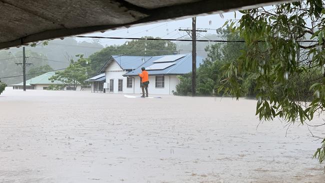 A paddle boarder rides down Cromer Street in South Lismore on February 28, 2022.