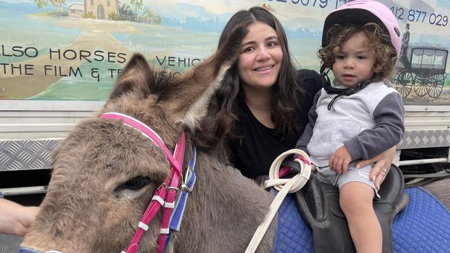 Samantha Eldebs and her son Matthew round out a donkey ride.