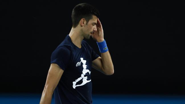 Novak Djokovic reacts during a practice session at Melbourne Park ahead of the 2022 Australian Open. Picture: Getty Images