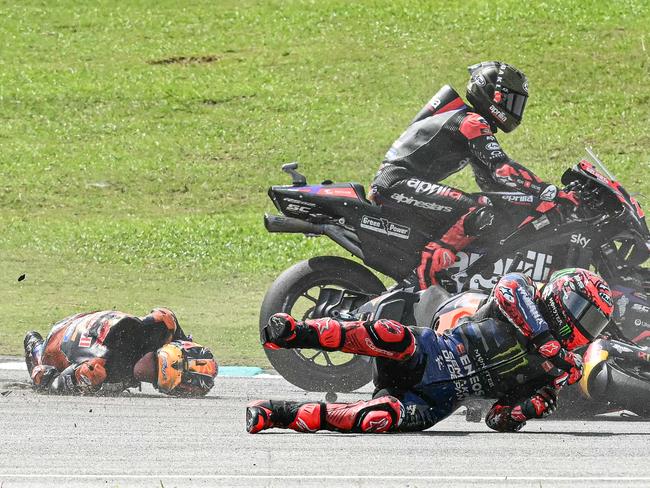 Monster Energy Yamaha MotoGP’s French rider Fabio Quartararo (R) and Red Bull KTM Factory’s Australian rider Jack Miller (L) fall after a collision during the MotoGP Malaysian Grand Prix. Picture: MOHD RASFAN / AFP