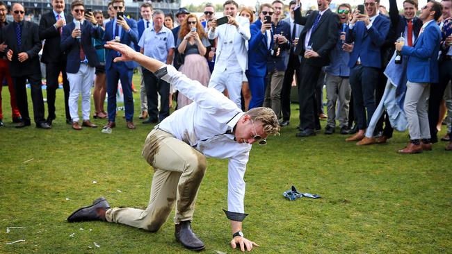 2019 Melbourne Cup Day at Flemington Racecourse, Melbourne, Victoria. Racegoers get rowdy after the last race. Picture: Mark Stewart