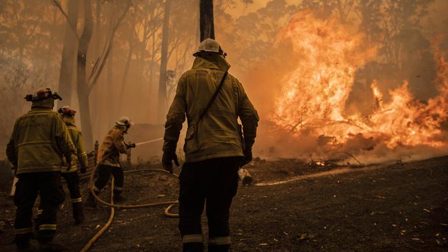 Firefighters try to protect remote properties on the NSW south coast during the Black Summer bushfires. Picture Gary Ramage